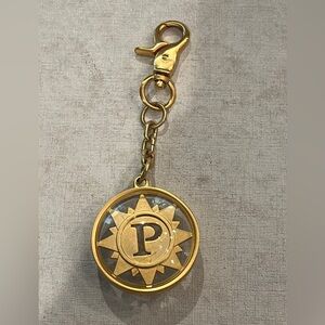 Parazul golden ‘P’ compass style bag charm. Fair